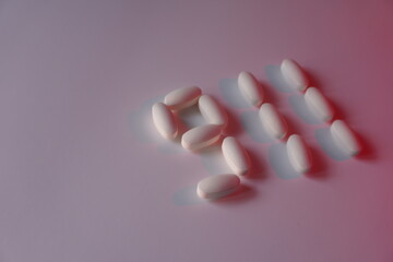 911 composed of white tablets on a light-colored background with a red tint.