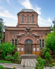 A stunning view of Alexander Nevsky Church showcases its intricate red bricks architecture amidst...