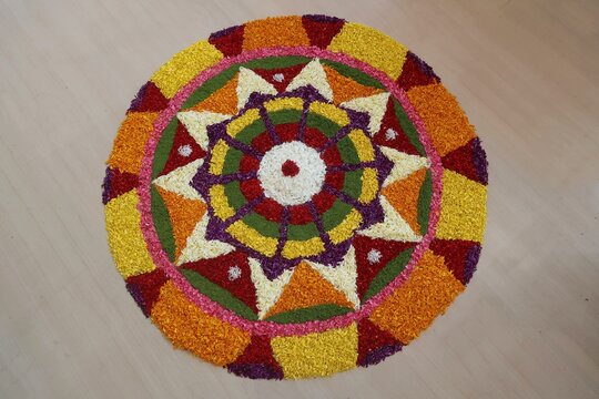 pookalam designs for onam celebrations	, pookalam made for part of onam celibration in kerala, india. it also referred to as athapookalam, is often made in a circular shape with flowers on floor.