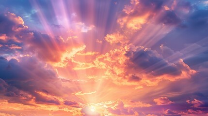 Obraz premium A beautiful sky background featuring a stunning array of clouds painted in shades of pink, orange, and purple during a dramatic sunset, with rays of sunlight breaking through and casting a warm glow