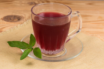 Cold drink from boiled fruits and berries in glass cup