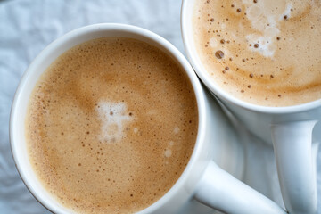 Two cups of cappuccino close up