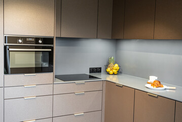 Interior of a Modern Kitchen in a New House. Dining Table and Chairs in Stylish and Functional...
