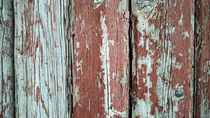 Wooden planks brown with old peeling paint, vertical full frame top view. Background texture photo