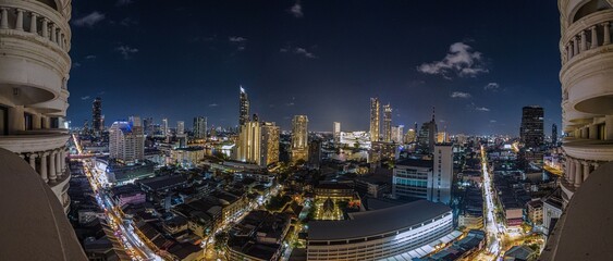 Fototapeta premium Aerial panoramic view of Bangkok cityscape at night in Thailand