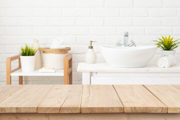 Table top from wooden planks for product display in blurred spa bathroom interior background