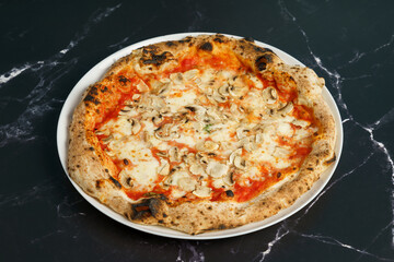 Original Italian pizza with ham, tomato sauce and cheese