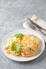 Chicken or vegetable cutlets with a side dish of bulgur in a plate on the table. Diet nutrition