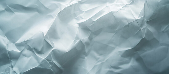 Obraz premium Textured white crumpled paper uneven soft wrinkles across the surfac