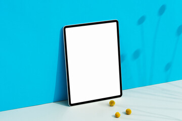 Blank screen digital tablet mockup on blue background