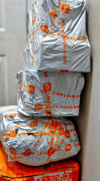 Stacked Temu Delivery Packages