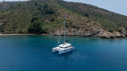 Fototapeta premium Stunning drone shot of a catamaran navigating the open sea