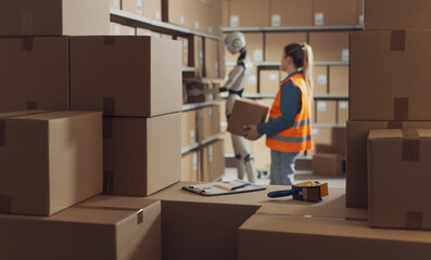 Warehouse worker and AI robot working together