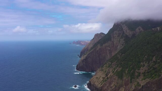 Mountains, Cliffs and Ocean. Vereda do Larano. Madeira, Portugal. Aerial View. Moving Sideways