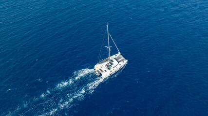 The beauty of a catamaran cruising, seen from above.