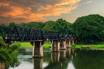 Fototapeta premium Beautiful landscape of Bridge River Kwai at Kanchanaburi, Thailand in morning time. Is a famous place and a tourist destination