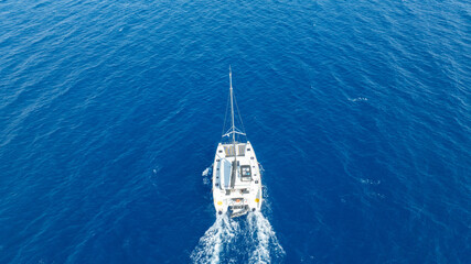  catamaran sailing gracefully, captured by a drone.