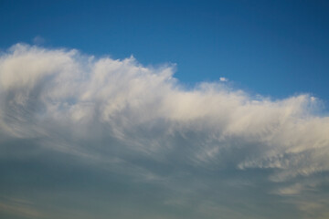 White feather clouds in the blue sky