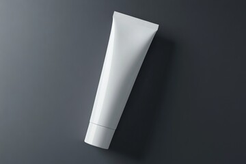 An empty cosmetic paste plastic packaging cover mockup of a blank white tube lying with a 3D rendering. A clear skincare cream packaging mockup. A clean ointment gel container with logo branding.