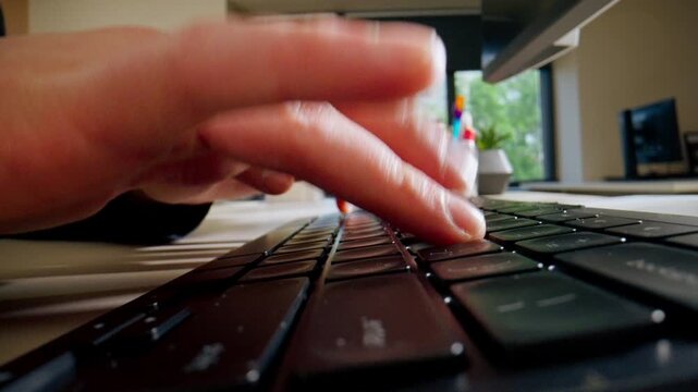 close-up female young hands pressing the buttons on the keyboard office device nude manicure professional keyboard camera movement