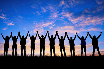 Silhouettes of group people men and women standing in celebration their victory at sunset