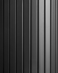 Obraz premium Dark Smooth polished wooden surface with vertical stripes. Natural light. Dark wood texture. Wooden planks painted black. Close-up. Front view. High quality photo