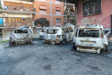 Cars burned in the courtyard of an apartment building