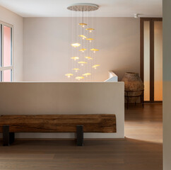 Interior of modern house entrance with a classical style, a beam of light enters and illuminates...