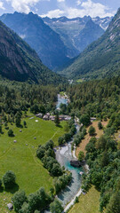 Aerial view of Val di Mello, a green valley surrounded by granite mountains and woods, renamed the Italian Yosemite Valley by nature lovers. Val Masino, Valtellina, Sondrio. Italy