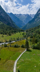 Aerial view of Val di Mello, a green valley surrounded by granite mountains and woods, renamed the Italian Yosemite Valley by nature lovers. Val Masino, Valtellina, Sondrio. Italy