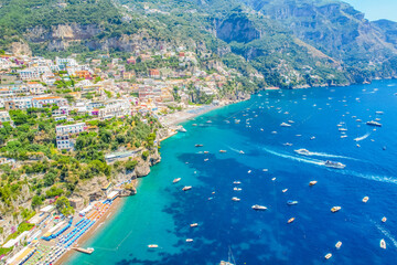 Positano town, beach and beautiful colorful houses on the cliff in Amalfi coast in Italy © Zedspider