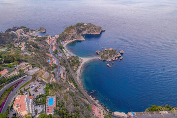 Obraz premium Aerial view of the Ancient theater of Taormina with Mount Etna in the background, Sicily, Italy. Isola Bella island