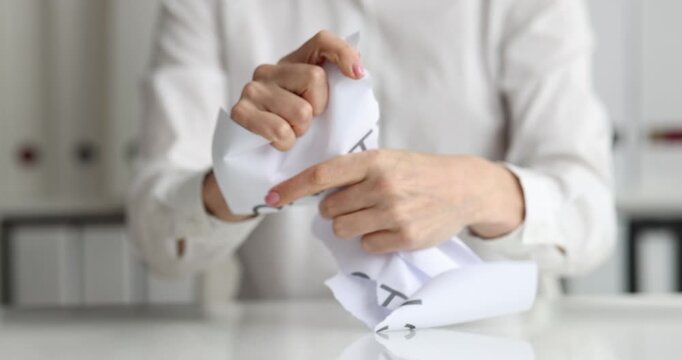 Businesswoman tears up paper with inscription contract. Grounds for changing and terminating business contract