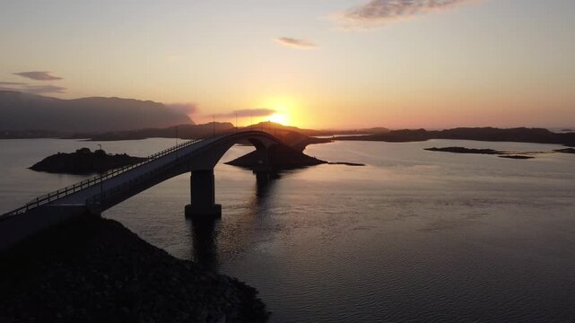 bridge in Lofoten seen from above during the midnight sun evening light