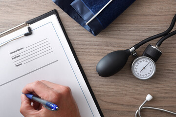 Doctor prescribing blood pressure medication top view