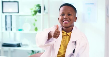 Young Boy Gives Thumbs Up In Doctor Costume