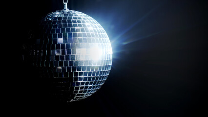 A close-up of a rotating disco ball casting dynamic light reflections on a black background. Ideal...
