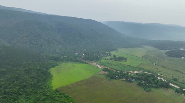 Peaceful Countryside Aerial Shot of winter Green Valley and Hills