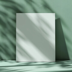 Blank canvas with shadow play on green wall