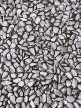 Smooth Black Pebbles Background - High-Resolution Natural Stone Texture Photo.