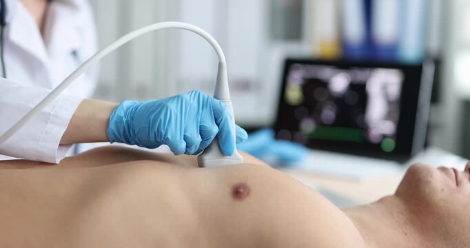 Doctor diagnosing heart patient male work on ultrasound equipment in hospitals. Examination of cardiovascular system concept