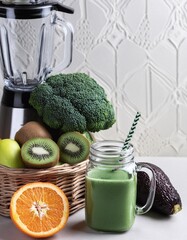 Green smoothie and blender ,broccoli,kiwi,orange ,healthy fruit and vegetables ,high vitamin and nutrition 