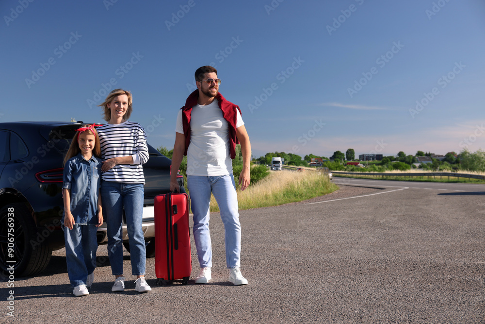 Sticker Happy family with red suitcase near car outdoors, space for text