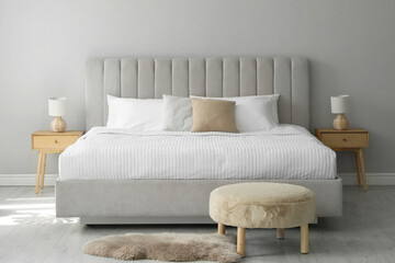 Stylish contemporary bedroom interior with comfortable bed