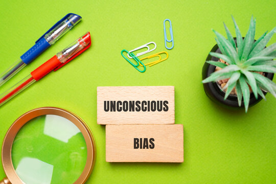 Unconscious bias concept - attitudes or stereotypes that affect our understanding, actions, and decisions in an unconscious manner. Implicit bias. Social norms or cultural influences. Wooden blocks