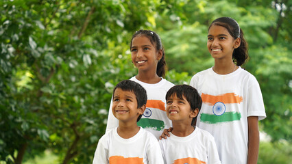 Group of happy Indian holding indian tricolour flag celebrating Independence day or Republic day.