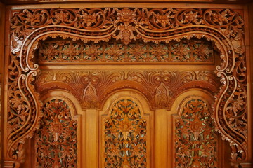 Fototapeta premium Antique wood carving ornaments are often found in home decorations, both furniture and interiors.