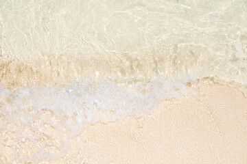 top view close-up beach sand and sea water background.