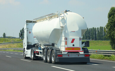 fuel tanker truck hauling flammable liquid on a highway