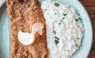 Crispy filet mignon parmigiana served with parmesan and lemon risotto